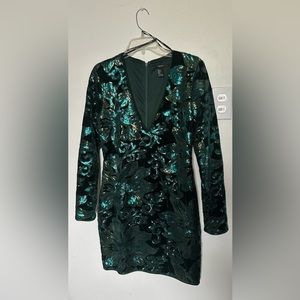 Beautiful velvet dress with sequin design in emerald green ideal for formal.